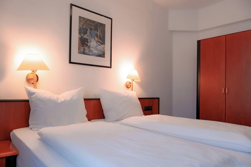 Standard Double or Twin Room | Minibar, desk, laptop workspace, blackout drapes