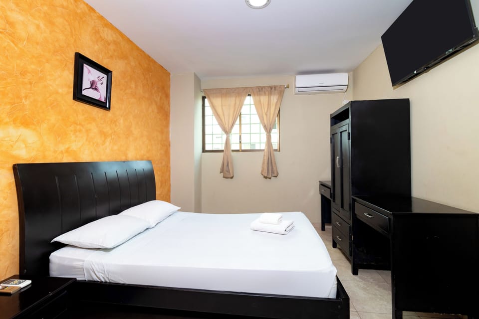 Double Room | Blackout drapes, iron/ironing board (on request), bed sheets