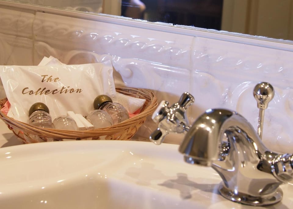 Shower, rainfall showerhead, hair dryer, towels