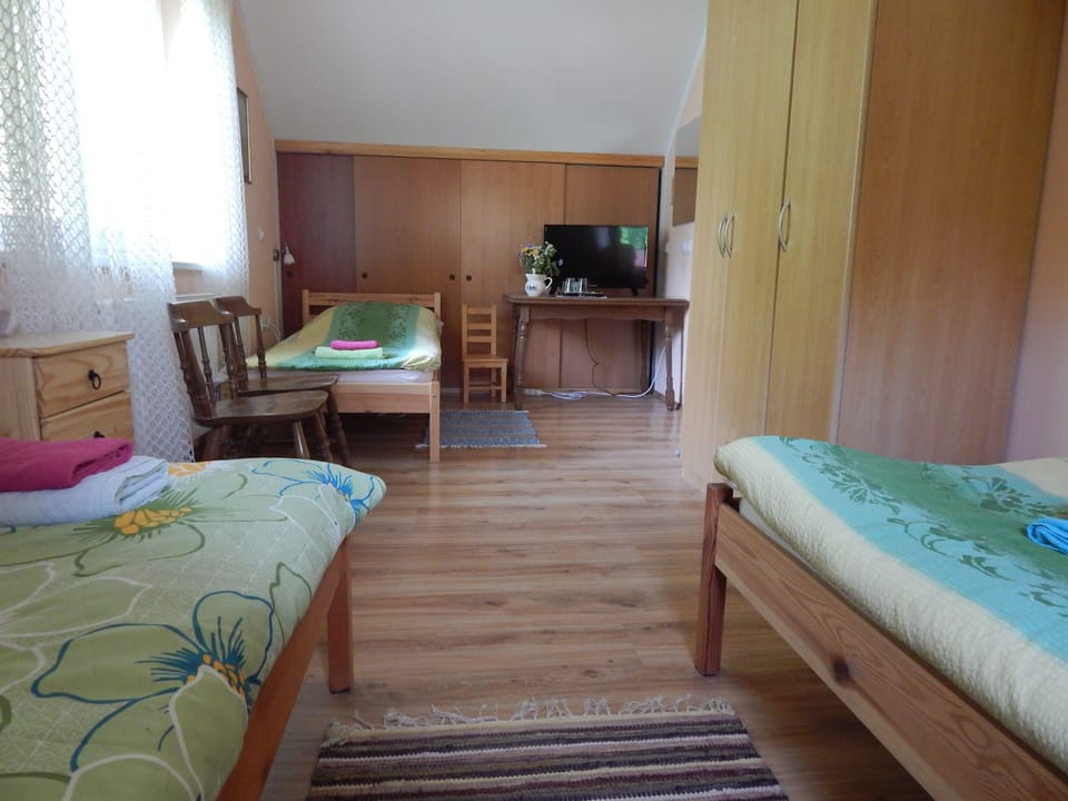 Triple Room, Shared Bathroom | Blackout drapes, iron/ironing board, free cribs/infant beds