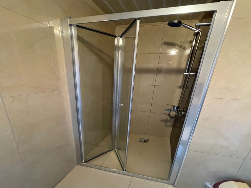 Shower, hair dryer, slippers, towels