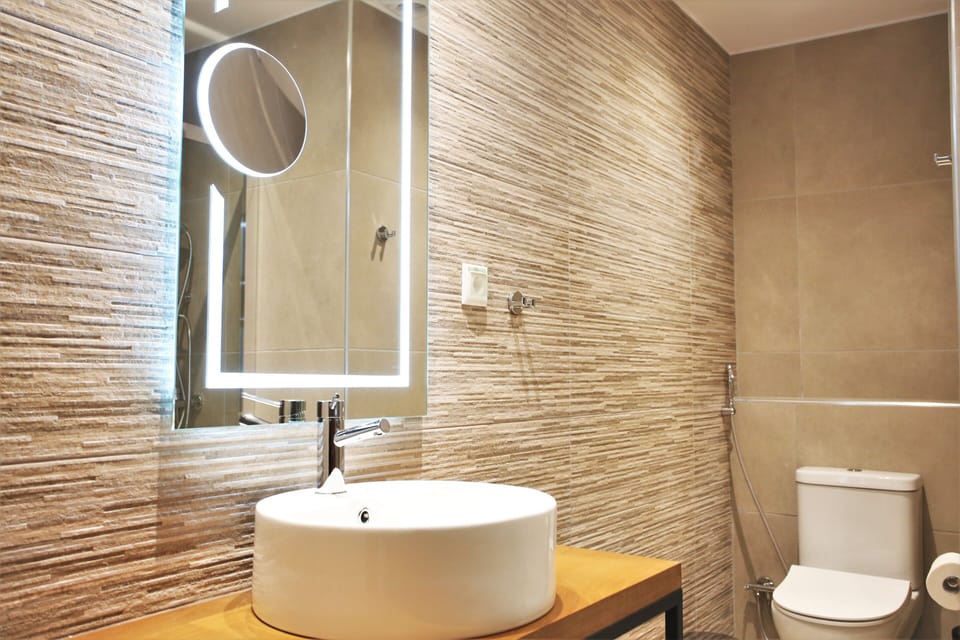 Designer toiletries, hair dryer, towels