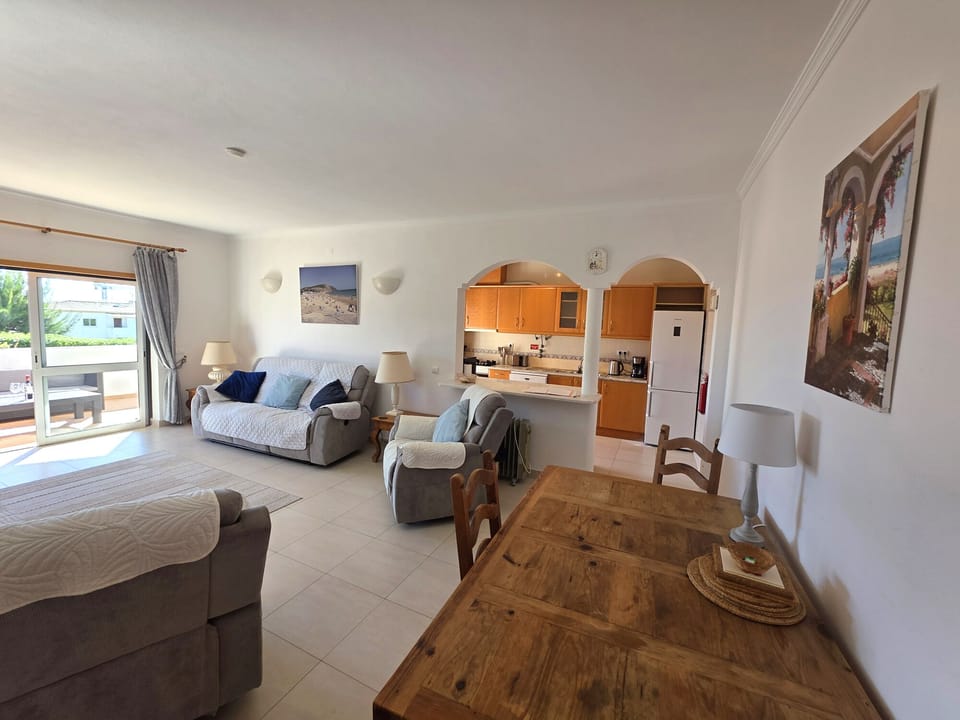 Lounge/Diner with adjoining Kitchen and doors to the terrace overlooking pool.