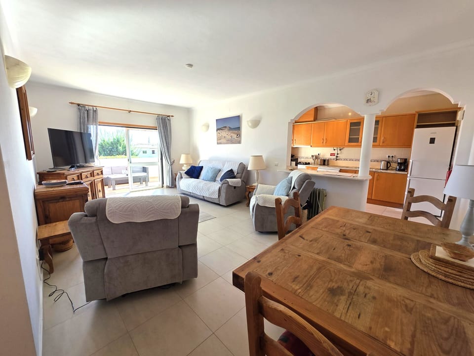 Spacious Living Room and adjoining Kitchen. All rooms open to the large terrace.