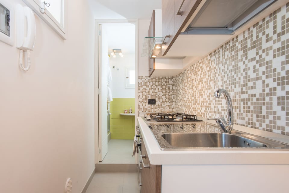 Cozy Panoramic Studio with Loft Bed, Rooftop | Private kitchen | Full-size fridge, oven, stovetop, cookware/dishes/utensils