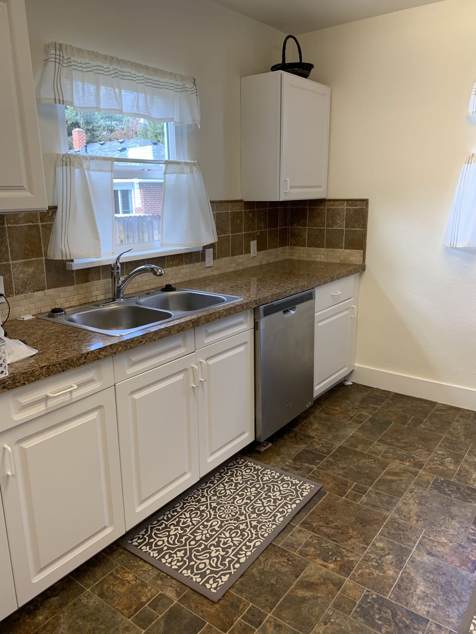 Fully equipped kitchen with disposal, dishwasher, dishes and pots and pans.  