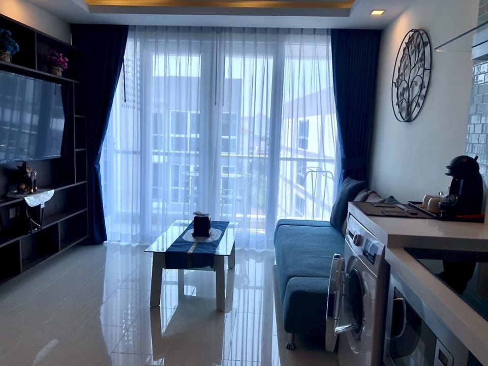 Open Plan kitchen, Washing Machine, glass coffee table etc.