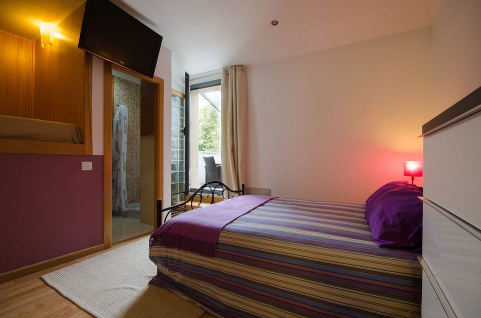 Apartment, 1 Bedroom | Desk, blackout drapes, soundproofing, iron/ironing board