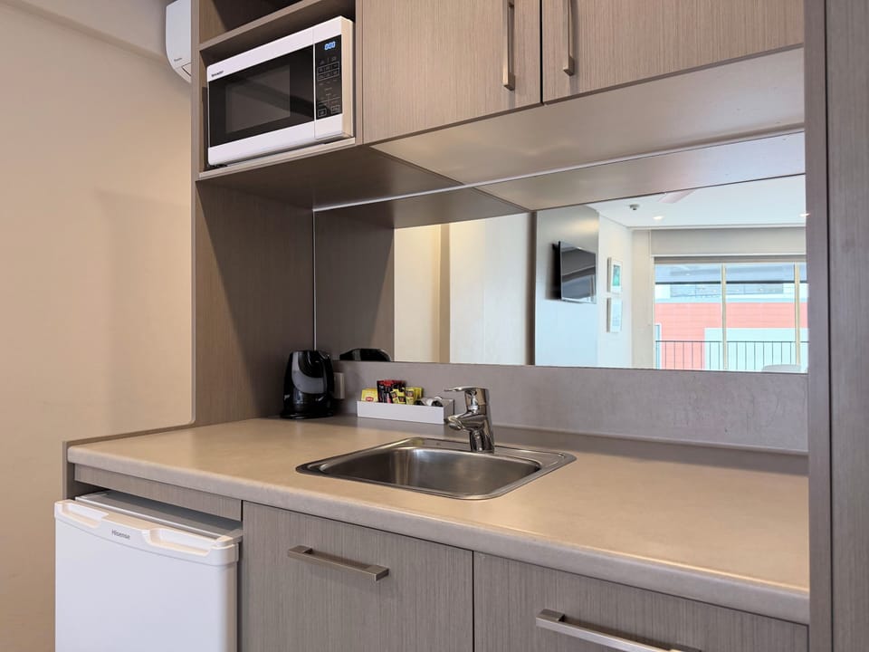 Triple Room, Sea View | Private kitchenette | Microwave, electric kettle