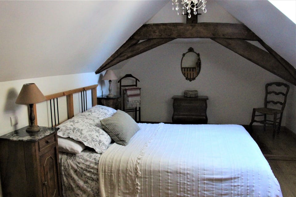 Master bedroom with double bed (and wooden cot).