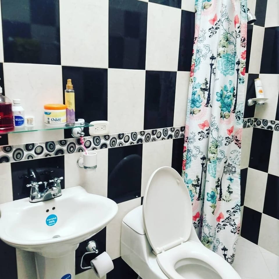 Deluxe Quadruple Room | Bathroom | Shower, towels, soap, toilet paper