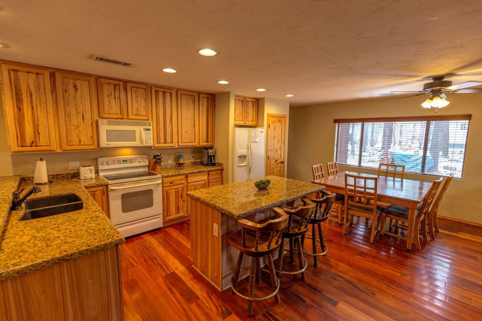 Kitchen with Granite Counters and large fridge
