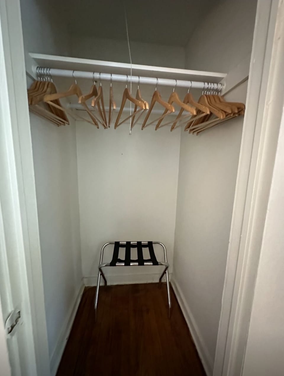 One of 2 closets with luggage rack & hangers