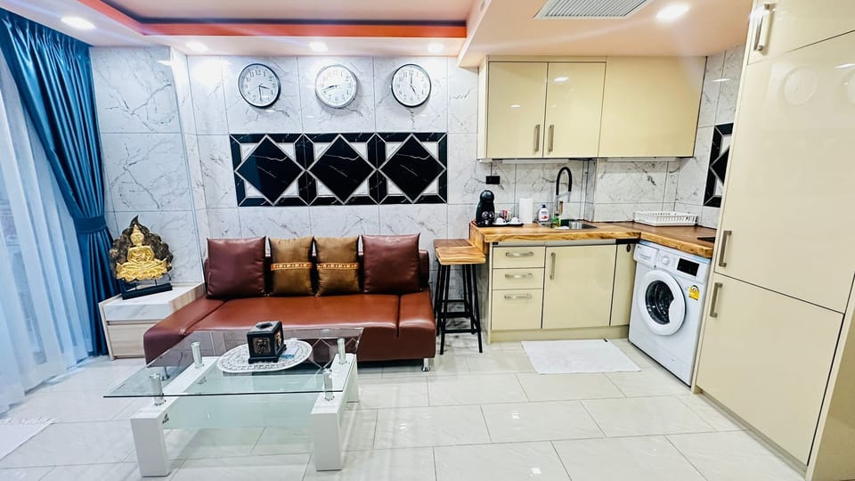 Living room with Sofa bed and Kitchen with Washing machine