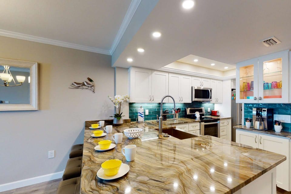 Spectacular kitchen with custom granite counters, premium appliances, special accent lighting throughout, and fully equipped for any meal preparation.