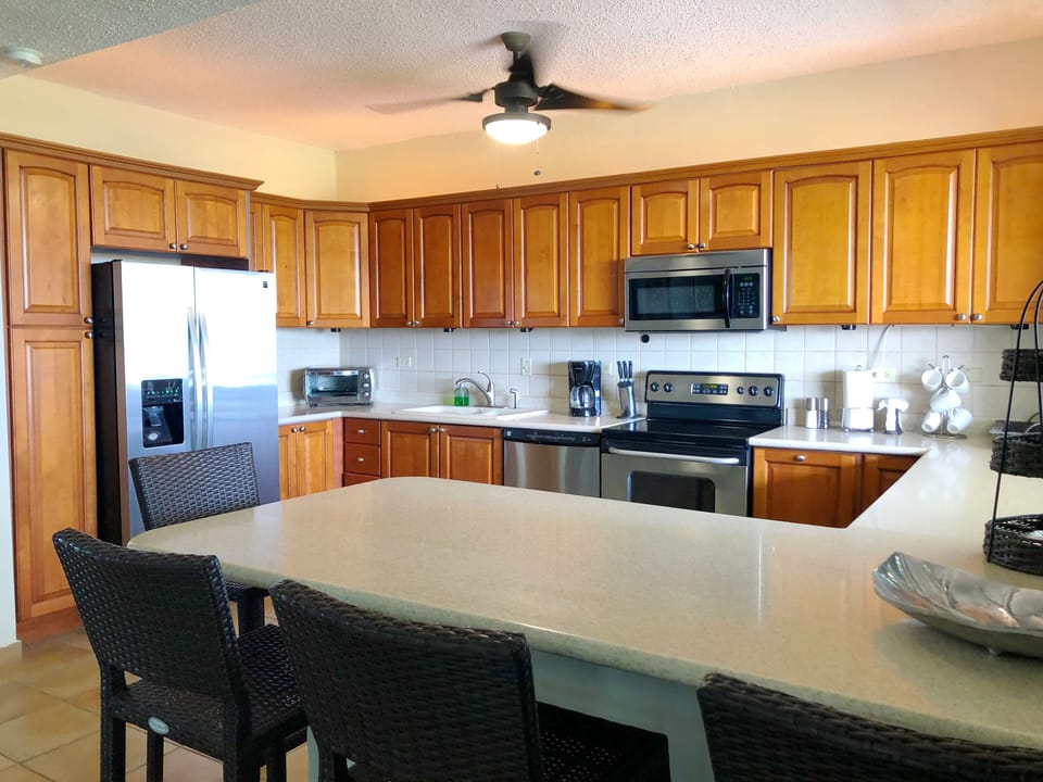 Seating area bar in the kitchen with 4 stools.