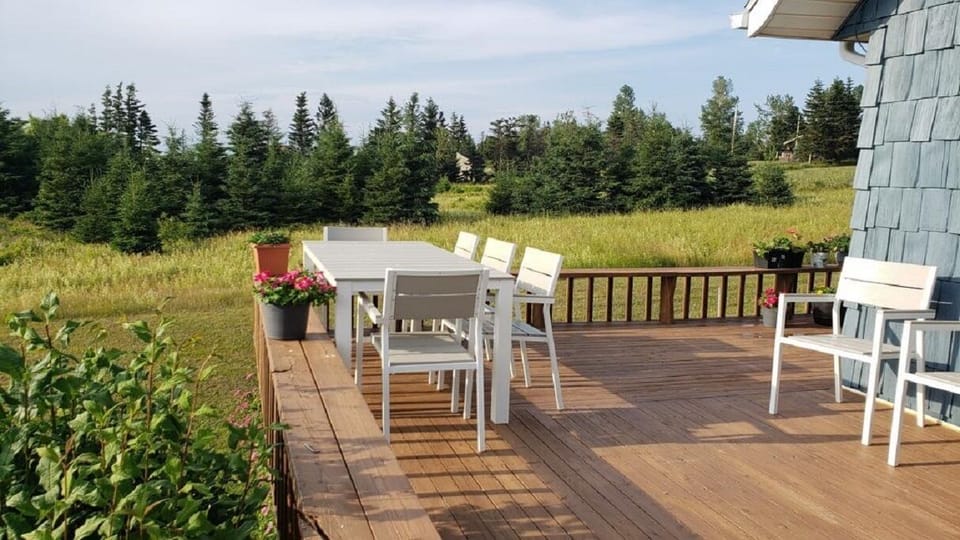 The wrap-around deck faces south: afternoon sun and sunsets galore. 
