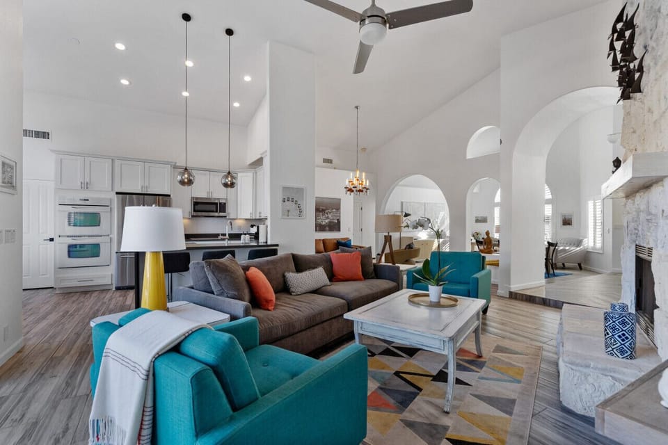Open great room contributes to the airiness of the home while still giving distinct and separate spaces for gathering