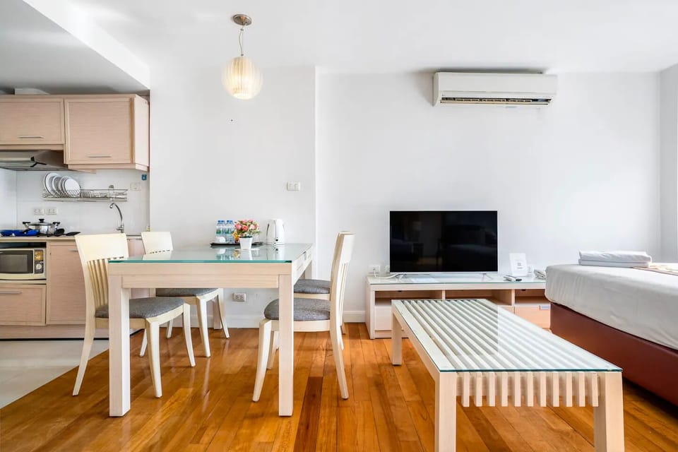 One Bedroom Suite (checkin 8am - 8pm) | Living area | 32-inch LCD TV with cable channels, TV, DVD player