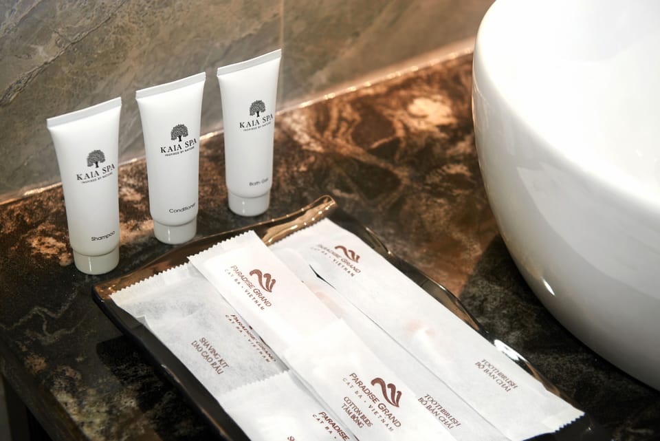 Designer toiletries, hair dryer, bathrobes, slippers