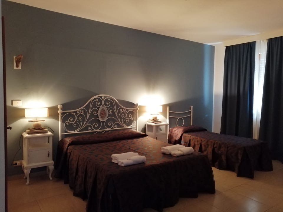 Quadruple Room, Private Bathroom | Hypo-allergenic bedding, down comforters, free minibar items