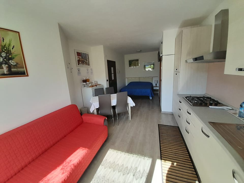 Family Studio, Kitchen, Garden Area | Down comforters, blackout drapes, free cribs/infant beds, travel crib