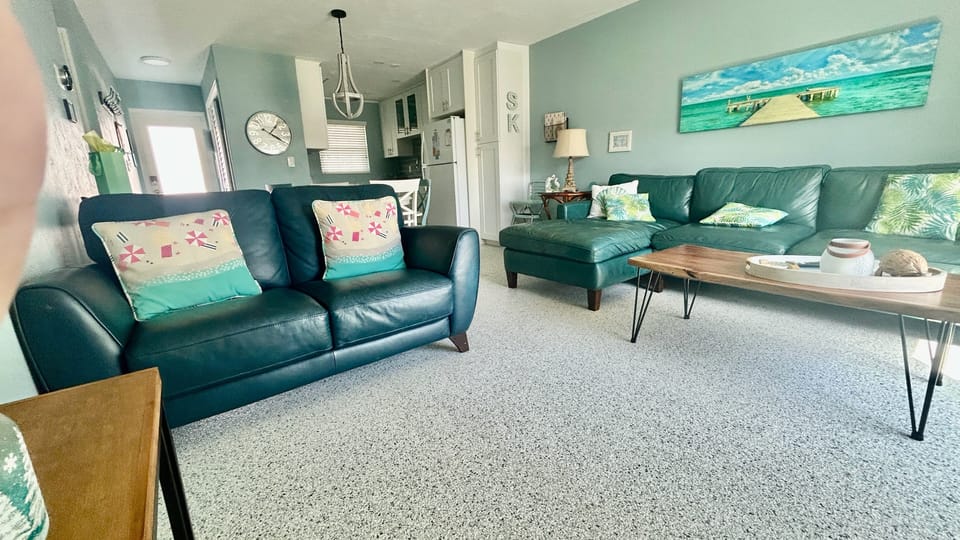 The family room offers plenty of seating to relax and watch TV.