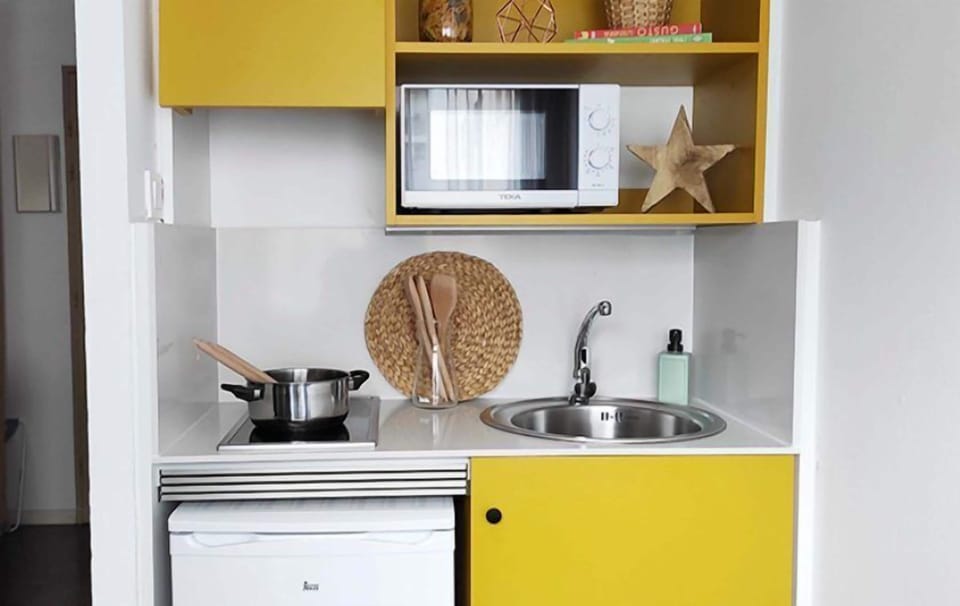 Mini-fridge, stovetop, cookware/dishes/utensils