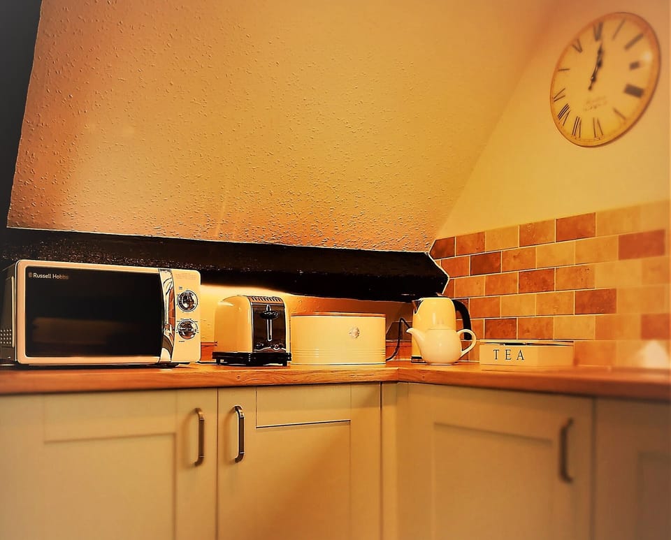 Fully equipped kitchen with modern appliances.