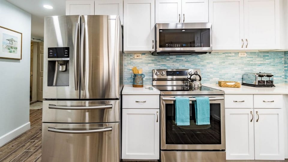 Modern kitchen essentials at your fingertips. This countertop setup offers everything you need for a quick breakfast or a relaxing cup of coffee.