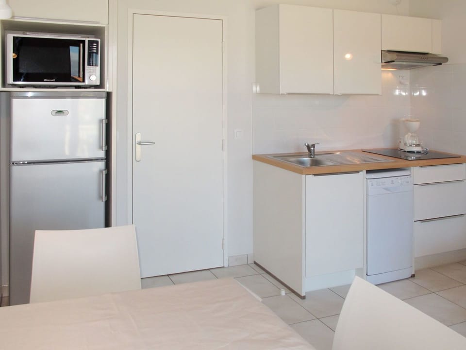 Property, Room, Kitchen, Cabinetry, Furniture, Major Appliance, Floor, Countertop, Building, Refrigerator