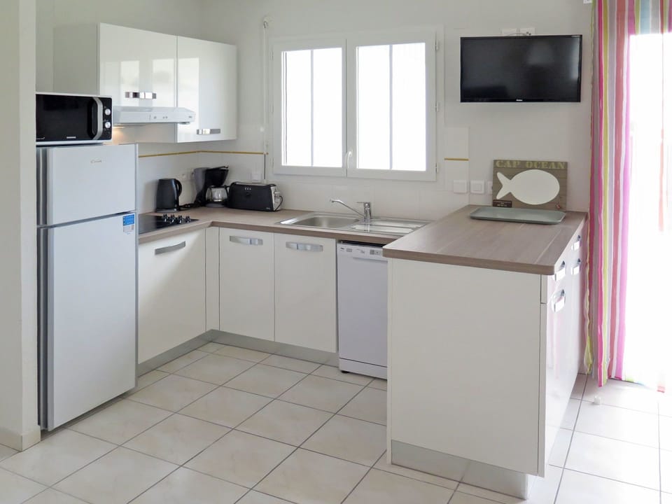 Room, Furniture, Kitchen, Property, Cabinetry, Major Appliance, Countertop, Kitchen Stove, Building, Floor