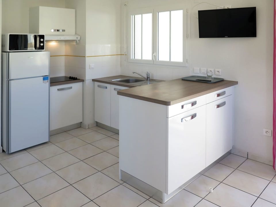 Property, Room, Kitchen, Countertop, Cabinetry, Furniture, Floor, Major Appliance, Kitchen Stove, Building