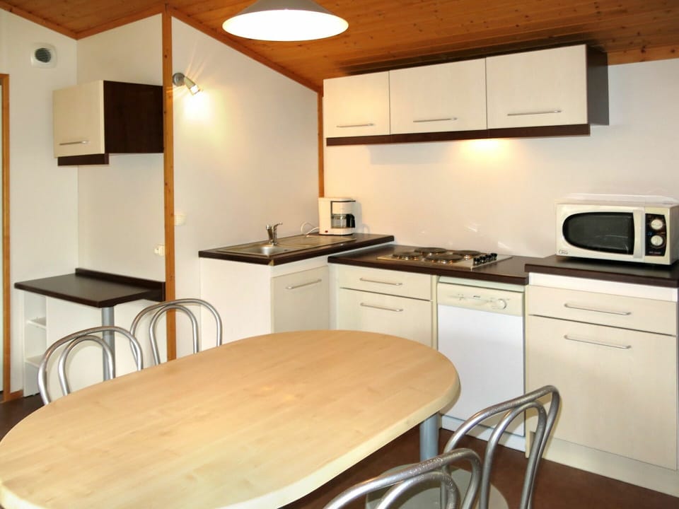 Cabinetry, Furniture, Property, Countertop, Table, Chair, Wood, Kitchen Appliance, Kitchen, Interior Design