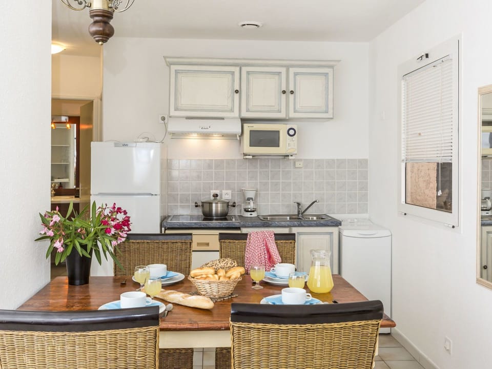 Room, Furniture, Property, Countertop, Kitchen, Interior Design, Yellow, Building, Ceiling, Cabinetry