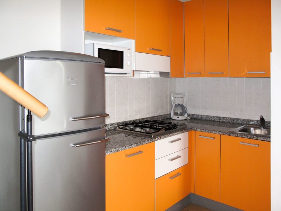 Orange, Kitchen, Cabinetry, Room, Yellow, Property, Countertop, Major Appliance, Furniture, Kitchen Appliance