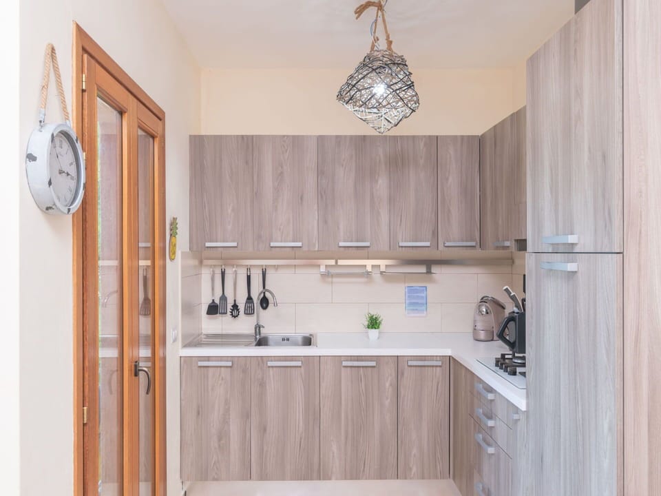 Brown, Cabinetry, Countertop, Property, Sink, Kitchen Sink, Wood, Lighting, Building, Interior Design