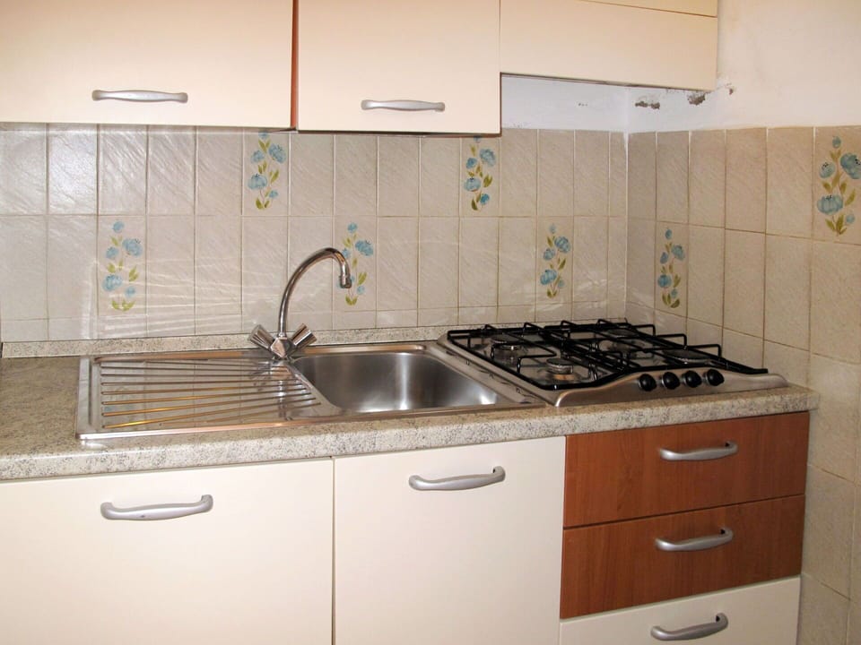Sink, Countertop, Kitchen Sink, Property, Kitchen, Room, Cabinetry, Tile, Furniture, Interior Design