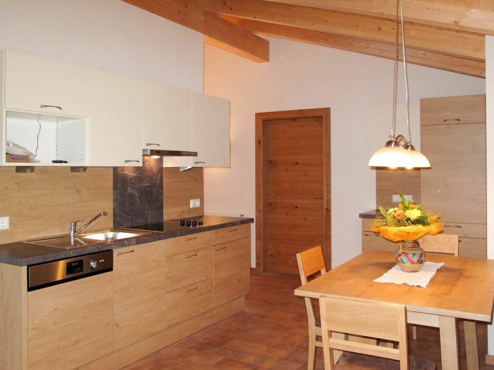 Furniture, Table, Cabinetry, Property, Countertop, Kitchen, Building, Wood, Flower, Interior Design