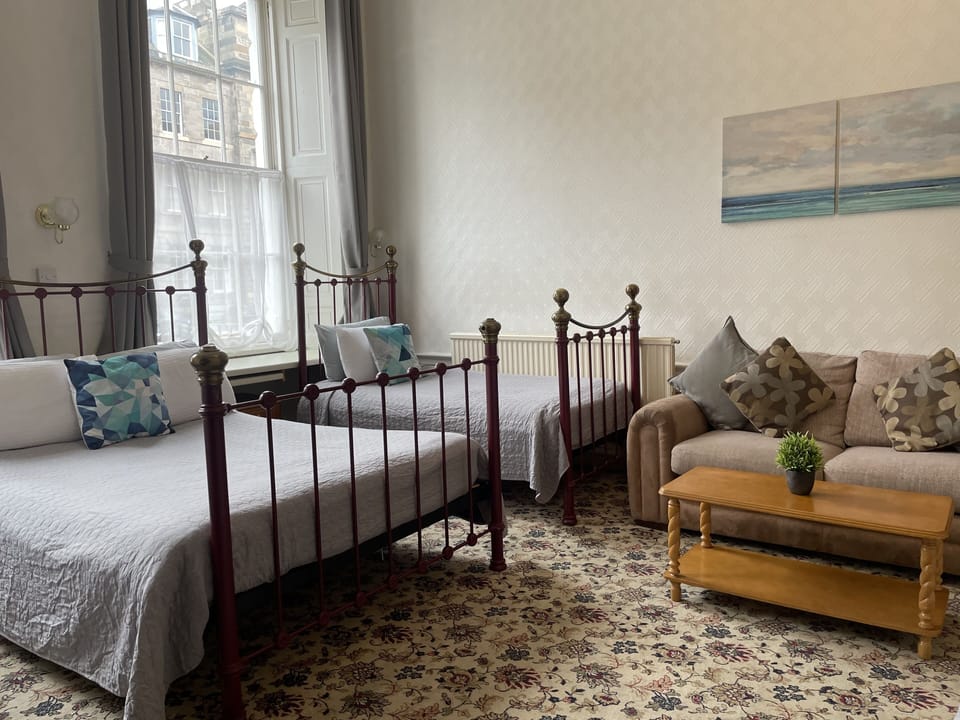 Family Room | Desk, iron/ironing board, free WiFi, bed sheets