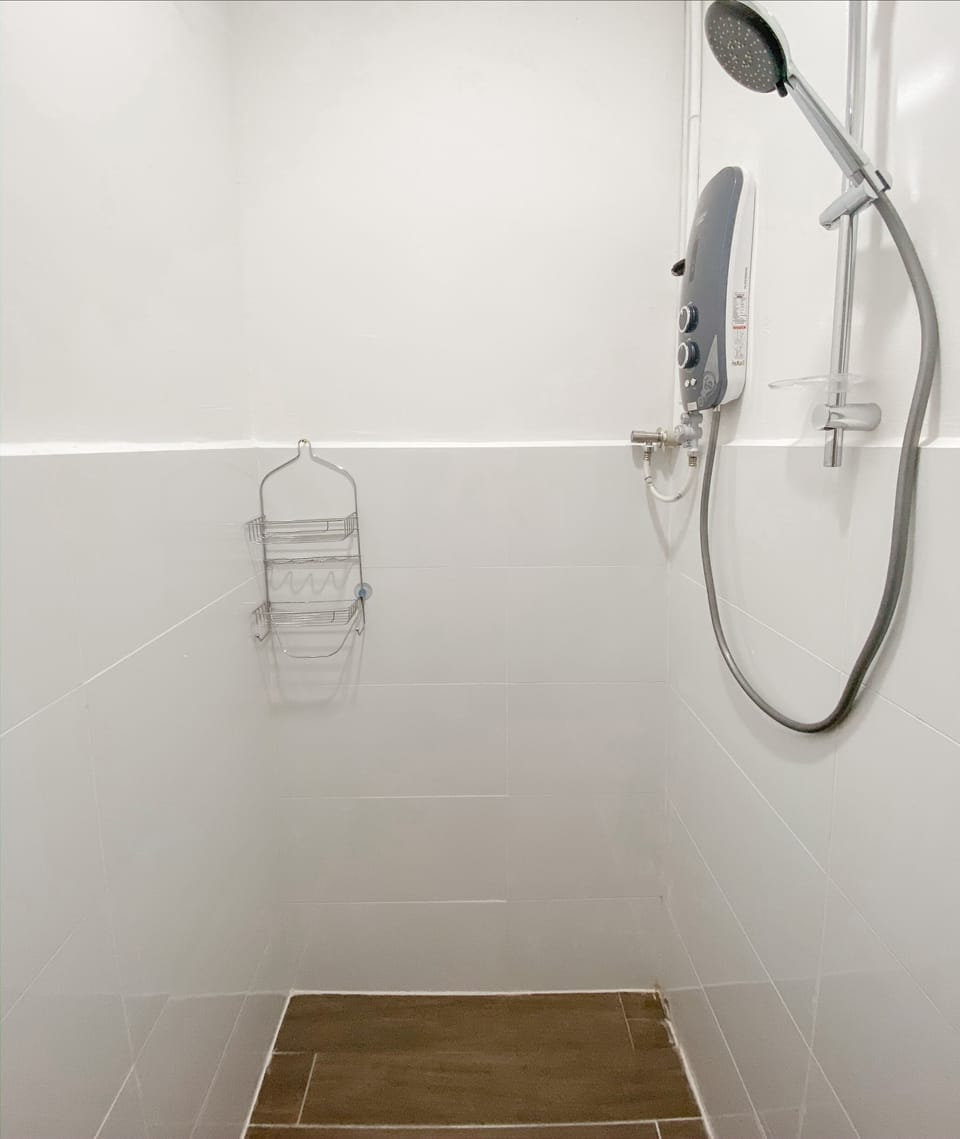 Shower, hair dryer, slippers, towels