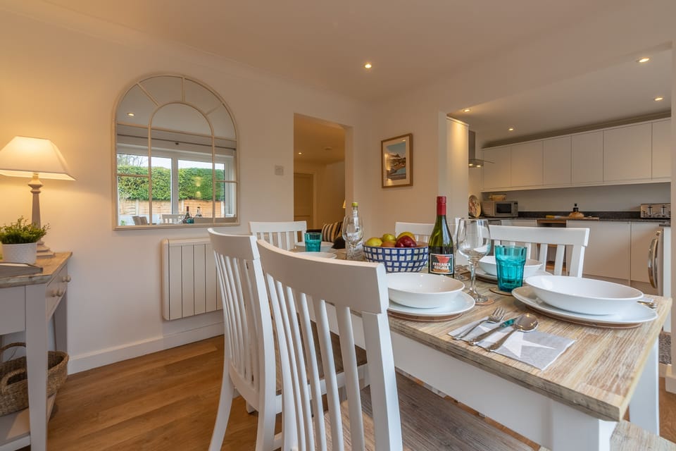 Ground floor: Dining area with kitchen beyond