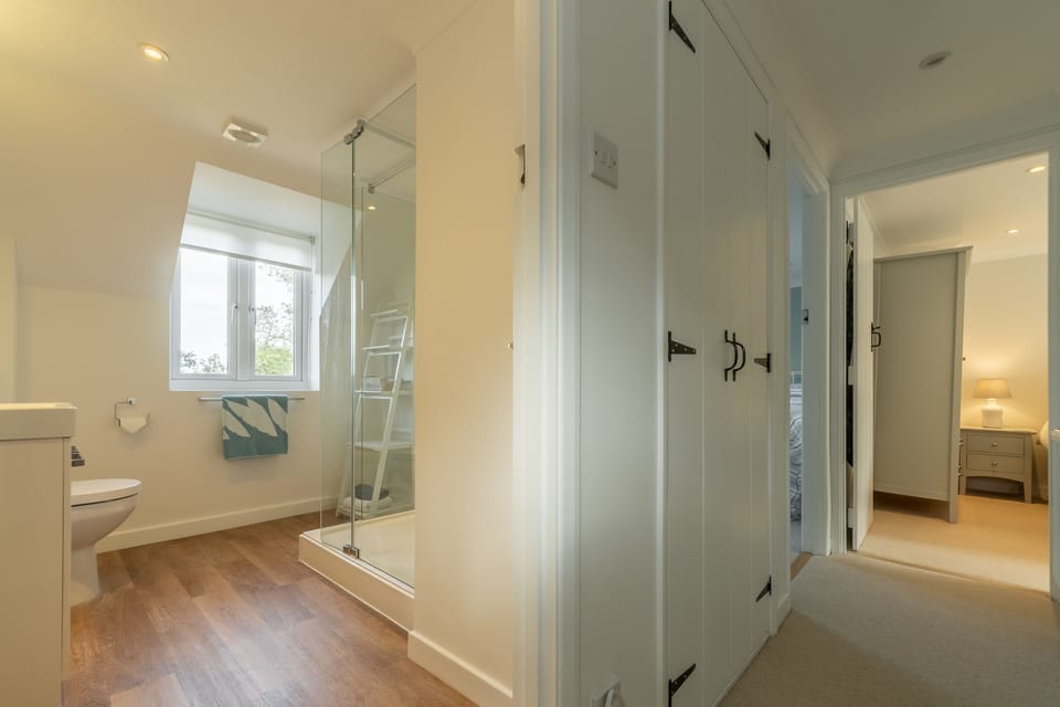 First floor: Landing with view into shower room