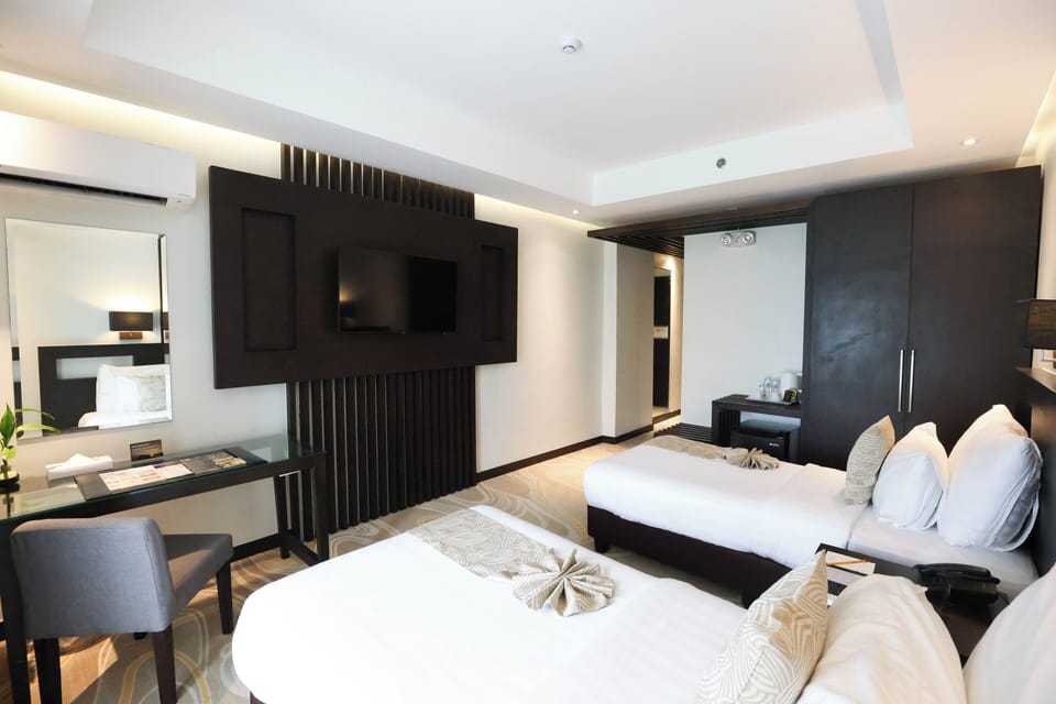 Premium bedding, in-room safe, desk, iron/ironing board (on request)