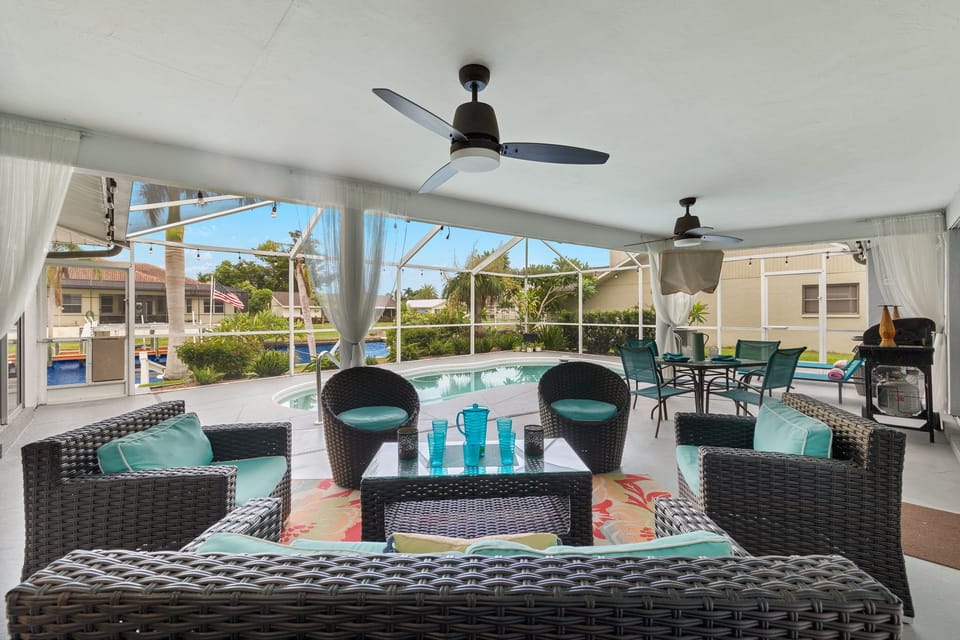 There is plenty of seating & a flat-screen TV by the pool