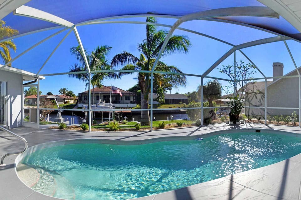 The electric-heated pool overlooks the wide canal
