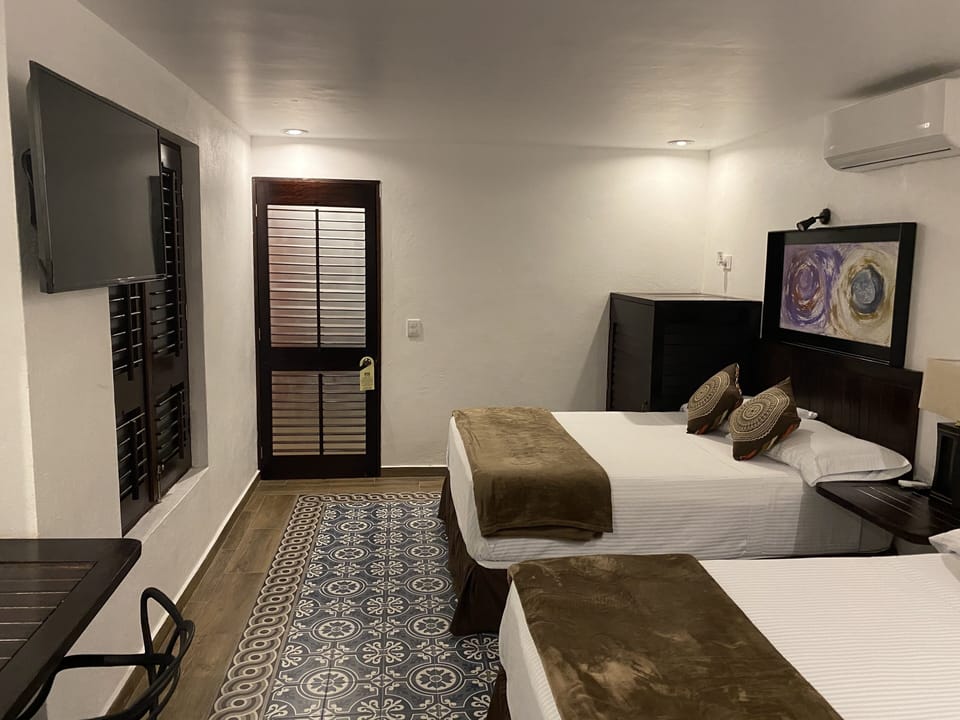 Deluxe Room, 2 Double Beds | Iron/ironing board, WiFi (free), bed sheets