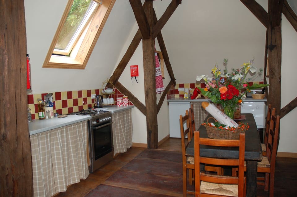 Fully equipped kitchen leading on to deck terrace with gazebo