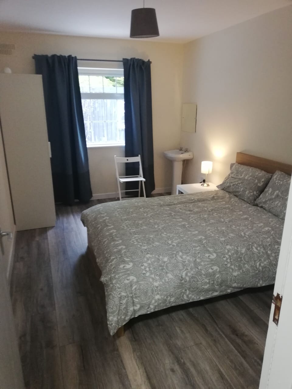 Double bedroom with natural light and garden views