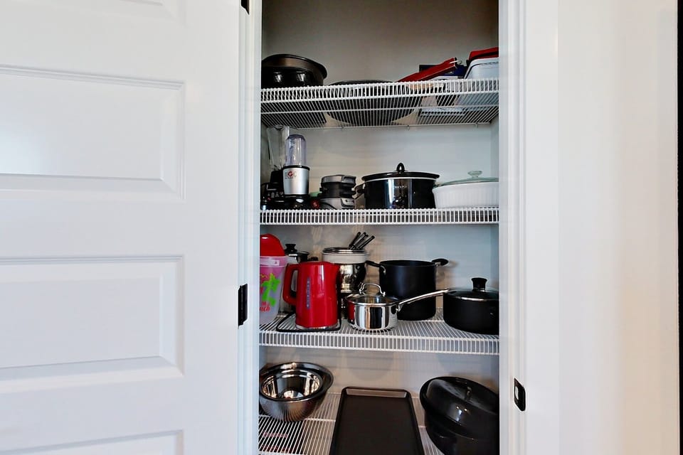 All cookware and necessities are stored in the pantry.